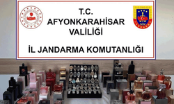 Afyon'da jandarma kaçak parfüm ve kol saati ele geçirdi