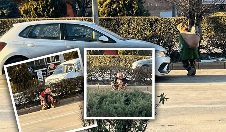 Eskişehir’de sırtında çocukla dilendi, trafikte canını hiçe saydı